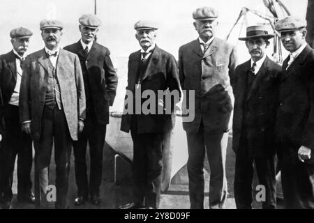 Henry Morrison Flagler (center), railroad and oil tycoon, standing with men from the Florida East Coast Railway for the opening of the Florida Keys Railway, also known as the Over-Sea Railway, connecting the Florida mainland with Key West, on January 22, 1912. (USA) Stock Photo