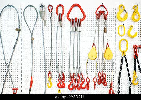 Hooks, metal cables and chains on exhibition Stock Photo