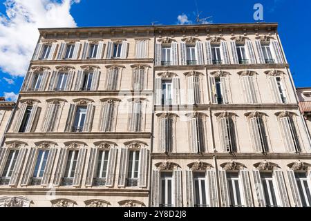 Traditional apartment  buildings with shuttered windows on the Boulevard André-Aune, Marseille, France Stock Photo