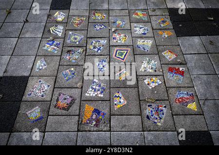 AMSTERDAM - The tile mosaics at the Vliegramp monument during the annual commemoration at 'the tree that saw everything' of the Bijlmer air disaster. On Sunday evening, Oct. 4, 1992, at 6:36 p.m., an El Al Boeing 747 cargo plane drilled into the Groeneveen and Klein-Kruitberg flats in Amsterdam's Bijlmermeer. The result was 43 deaths and enormous havoc. ANP RAMON VAN FLYMEN netherlands out - belgium out Credit: ANP/Alamy Live News Stock Photo