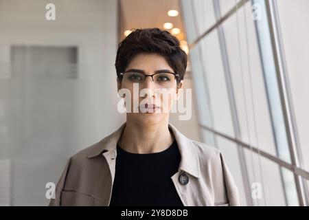 Serious confident short haired businesswoman posing for portrait Stock Photo