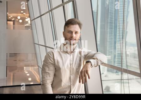 Handsome young Caucasian entrepreneur man posing for portrait Stock Photo