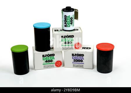 Maryville, Tennessee, United States – September 30, 2024: Horizontal shot of Ilford film, boxes and three film canisters on a white background. Stock Photo
