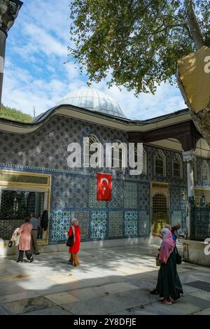 Istanbul, Turkey - September 23, 2024: People visiting the Eyup Sultan Mosque and the mausoleum of Abu Ayyub al-Ansari in Istanbul, Turkey. Stock Photo