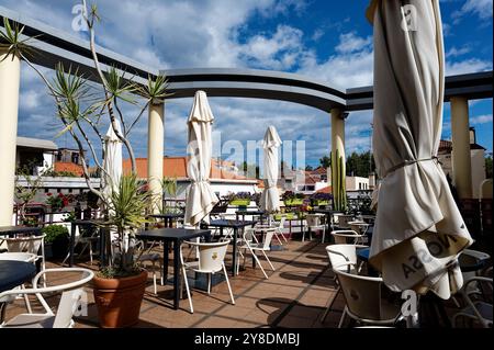 Sunny rooftop terrace at mercado dos lavradores, offering a peaceful escape with scenic views Stock Photo