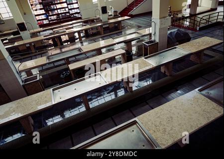 Empty market stalls with tiled counters and drainage, inside Funchal’s mercado dos lavradores Stock Photo