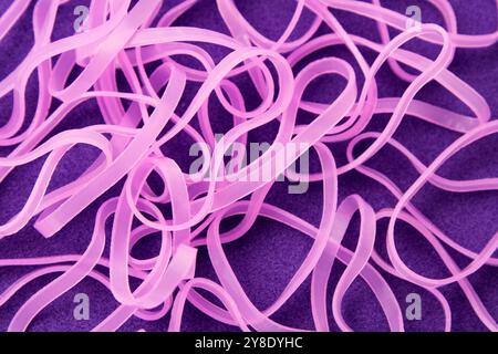 Pink elastics on a purple background Stock Photo