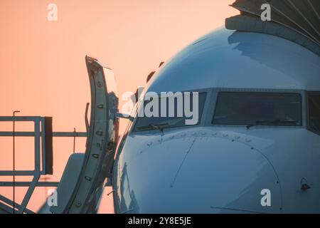 Airplane at Sunset with Open Door Stock Photo