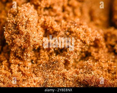 Close-up macro,almost abstract details of the fresh,sweet and sticky sugar grains,leading into a blurred black backdrop. Stock Photo
