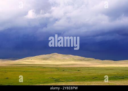 Panorama of Montenegro countryside at summer day. Wonderful summer landscape in mountains. grassy field and rolling hills. rural scenery. Stock Photo