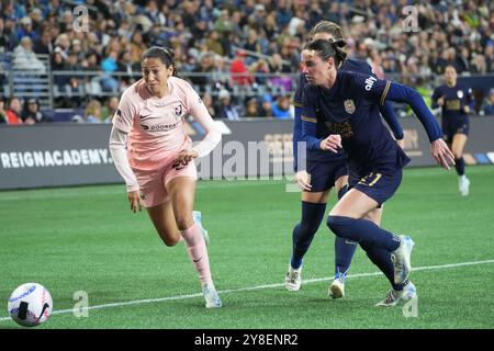 Seattle, United States. 04th Oct, 2024. Angel City FC forward Christen Press (23) and Seattle Reign FC defender Phoebe McClernon (21) chase down a loose ball during an NWSL match at Lumen Field in Seattle, Washington on October 4, 2024. (Photo credit Nate Koppelman/Sipa USA) Credit: Sipa USA/Alamy Live News Stock Photo