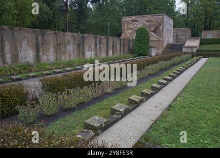 Riga, Lithuania - Sep 13, 2024: Brothers' Cemetery in Riga contains the graves of 2800 latvian soldiers and officers who died in World War II. Cloudy Stock Photo