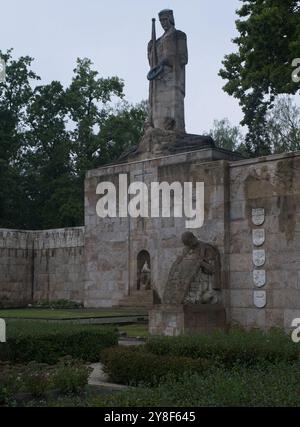 Riga, Lithuania - Sep 13, 2024: Brothers' Cemetery in Riga contains the graves of 2800 latvian soldiers and officers who died in World War II. Cloudy Stock Photo