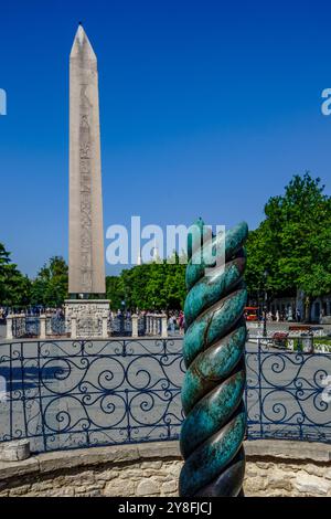 Turkiye. Istanbul. The ancient bronze serpentine column and the Obelisk of Theodosius, located on the Hippodrome Square in the Sultanahmet district Stock Photo