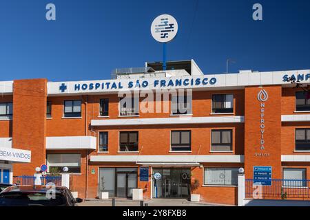 Hospital sao francisco medical building exterior with blue sky background showing dialysis and nephrology departments in leiria, portugal Stock Photo