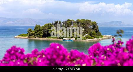 Mouse island at Mediterranean sea with flowers panorama vacation on Corfu island in Greece Stock Photo