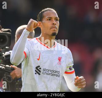 Liverpool's Virgil van Dijk celebrates after the Champions League round ...