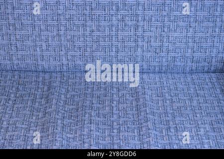 This image showcases a close-up of a fabric with a detailed geometric pattern. Stock Photo