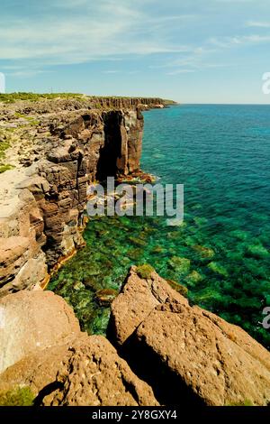 The Faraglioni of Nido dei Passeri, on the coast of Calasetta on the north coast of the island of Sant'Antioco, southern Sardinia, Italy Stock Photo