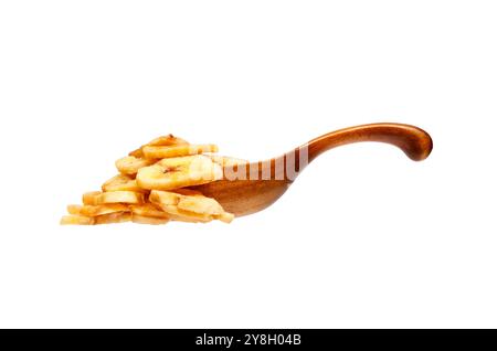 Banana chips in the wooden spoon, isolated on white background Stock Photo