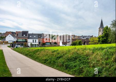 Concrete country road through the Flemish fields of Brussegem, Merchtem, Belgium, SEP 29, 2024 Stock Photo