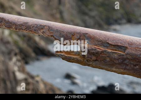 Rusty railing by the sea battered bt the Atlantic sea salted water Stock Photo