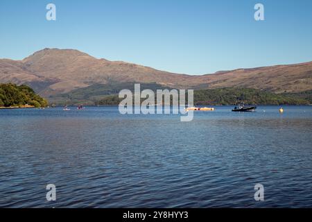 Luss, Loch Lomond, Argyll & Bute, Scotland, September, 2024, boats on the Loch Stock Photo
