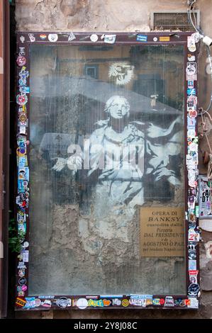 Madonna with a gun by Banksy in Naples / Madonna con la pistola di Banksy a Napoli Stock Photo