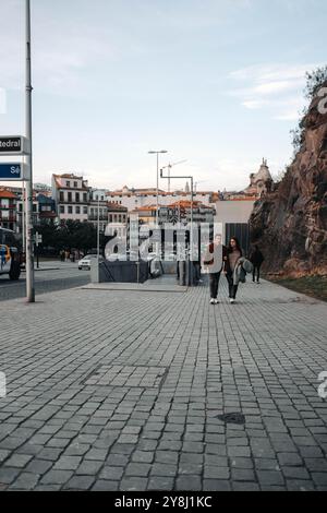 People walking past entrance to Sao Bento metro station in Porto, Portugal Stock Photo