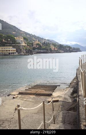 Towage lane in a pier next to a beach in an italian town on a cloudy day Stock Photo