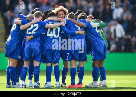 Leicester City team huddle ahead of kick off during the Premier League match between Leicester