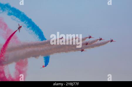 Duxford, Cambridgeshire, UK. 5th Oct 2024. The RAF Aerobatic Team, the Red Arrows, performing 'Tornado' where seven aircraft turn from left to right at 45 degrees while two aircraft barrel roll around them. This was the last public display for the Red Arrows in 2024. Credit: Stuart Robertson/Alamy Live News. Stock Photo