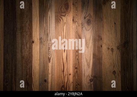 Elegant wooden planks background nicely lit with vignetting to draw the attention. Studio shot with warm pleasant color and real old wood Stock Photo