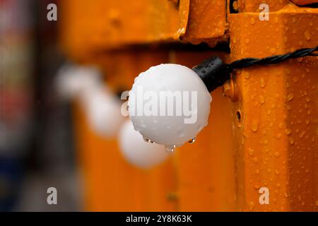 Light bulbs, shop decoration, in the rain Stock Photo