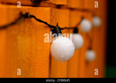 Light bulbs, shop decoration, in the rain Stock Photo