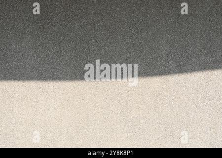 Abstract background from shadow on gravel wall. Stock Photo