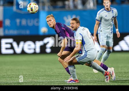 Charlotte, North Carolina, USA. 5th Oct, 2024. Charlotte FC forward KAROL SWIDERSKI (9) competes for the ball against CF Montréal midfielder SAMUEL PIETTE (6) during the first half of the Charlotte FC vs CF Montreal MLS match at Bank of America Stadium in Charlotte, NC on October 5, 2024. (Credit Image: © Cory Knowlton/ZUMA Press Wire) EDITORIAL USAGE ONLY! Not for Commercial USAGE! Stock Photo