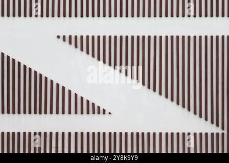 Abstract background from thin wood lath decorated on white cement wall Stock Photo