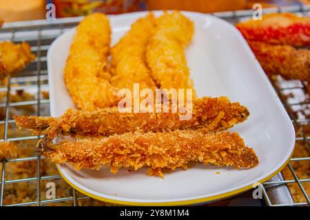 Deep fried Capelin Fish (Shishamo), Thai fried battered egg fish. Stock Photo