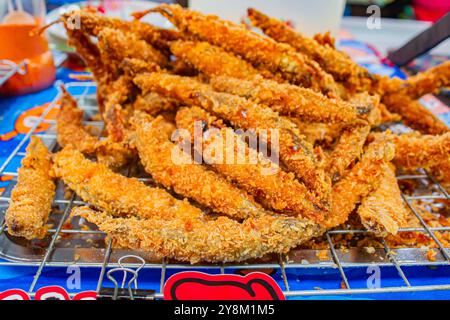 Deep fried Capelin Fish (Shishamo), Thai fried battered egg fish. Stock Photo