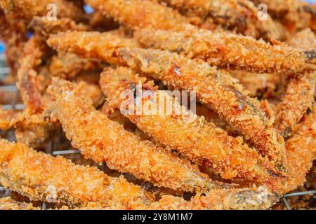 Deep fried Capelin Fish (Shishamo), Thai fried battered egg fish. Stock Photo