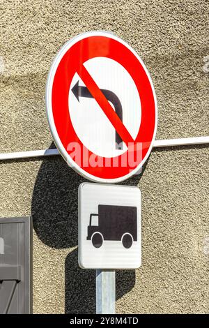 No left turn for HGVs / lorries at a narrow street junction - La Trimouille, Vienne (86), France. Stock Photo