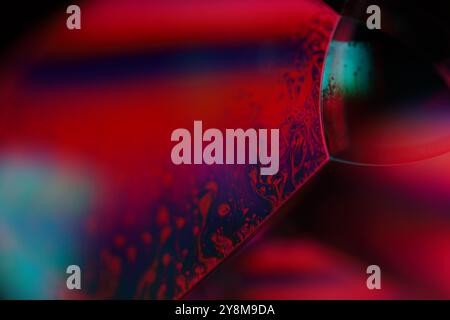 Red and purple fluid pattern, fluid background, plasma, fluid movement, red sphere, smooth movement, lines in the dark background Stock Photo