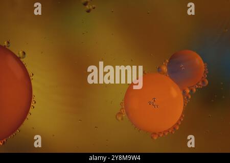 Colorful abstract macro background with oil drops in water Stock Photo