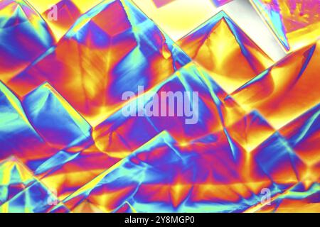 Crystals of Erbium Nitrate under a microscope. The crystals are precipitated from a solution on a microscope slide and photographed in polarized light Stock Photo