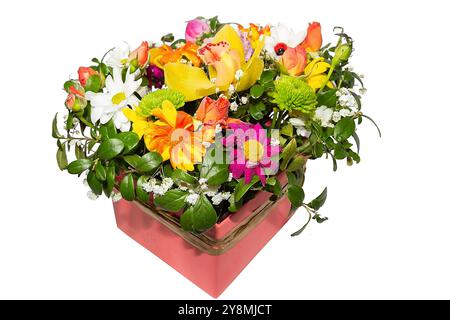 Bouquet of colorful flowers in pink box isolated on white background. Preparation for a holiday card Stock Photo