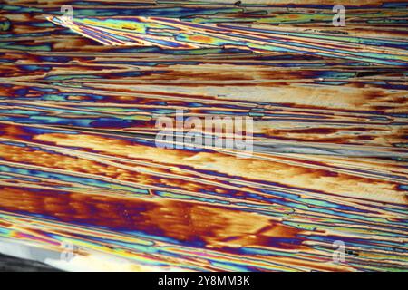 Crystals of Magnesium Sulfate or Epsom salt under a microscope. The crystals are precipitated from a solution on a microscope slide and photographed i Stock Photo