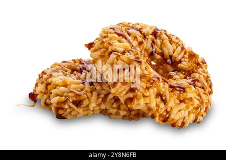 Crispy homemade cane sugar rice crackers isolated on white background with clipping path. Stock Photo