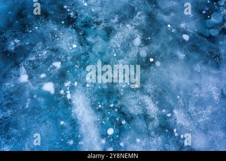 Beautiful natural methane bubbles in frozen lake on winter at Canada Stock Photo