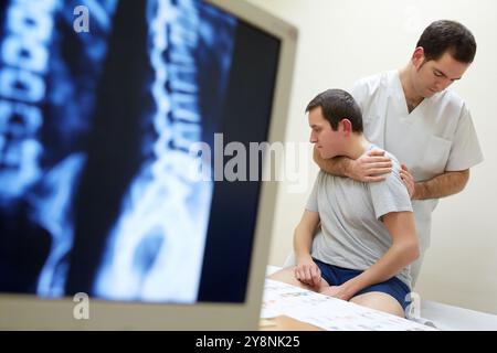 Rotation and passive flexion back X-ray image of the spinal column Physiotherapy medical center, Donostia, San Sebastian, Gipuzkoa, Basque Country, Spain. Stock Photo
